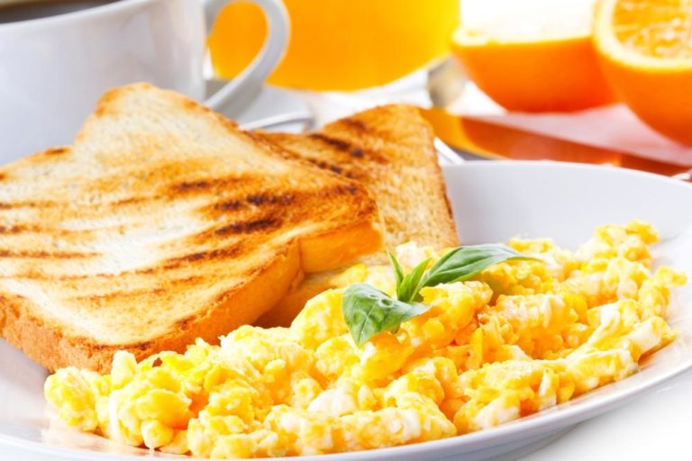 Scrambled Eggs, Toasts, Juice And Coffee