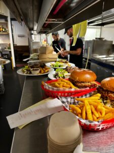 newly cooked burgers and fries